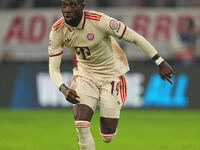 Alphonso Davies of Bayern Munich  controls the ball  during the Champions League Round 1 match between Bayern Munich v Dinamo Zagreb, at the...