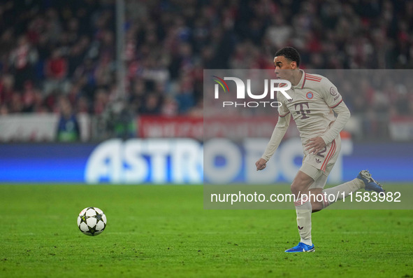 Jamal Musiala of Bayern Munich  controls the ball  during the Champions League Round 1 match between Bayern Munich v Dinamo Zagreb, at the A...