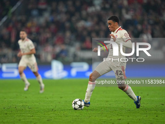 Jamal Musiala of Bayern Munich  controls the ball  during the Champions League Round 1 match between Bayern Munich v Dinamo Zagreb, at the A...