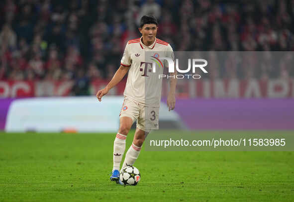 Minjae Kim of Bayern Munich  controls the ball  during the Champions League Round 1 match between Bayern Munich v Dinamo Zagreb, at the Alli...