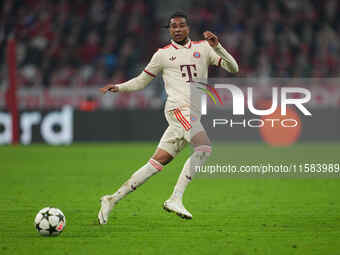 Michael Olise of Bayern Munich  controls the ball  during the Champions League Round 1 match between Bayern Munich v Dinamo Zagreb, at the A...