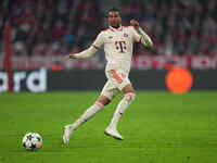 Michael Olise of Bayern Munich  controls the ball  during the Champions League Round 1 match between Bayern Munich v Dinamo Zagreb, at the A...