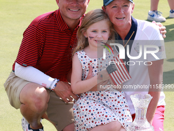 GAINESVILLE, VIRGINIA - SEPTEMBER 15: Captain Stacy Lewis of the United States poses with her husband Gerrod Chadwell and their daughter Che...