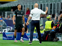 Trent Alexander-Arnold of Liverpool FC and Arne Slot head coach of Liverpool FC during the UEFA Champions League 2024/25 League Phase MD1 ma...