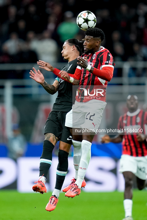 Emerson Royal of AC Milan and Darwin Nunez of Liverpool FC jump for the ball during the UEFA Champions League 2024/25 League Phase MD1 match...