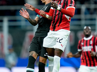 Emerson Royal of AC Milan and Darwin Nunez of Liverpool FC jump for the ball during the UEFA Champions League 2024/25 League Phase MD1 match...