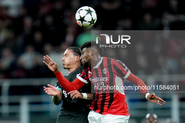 Emerson Royal of AC Milan and Darwin Nunez of Liverpool FC jump for the ball during the UEFA Champions League 2024/25 League Phase MD1 match...