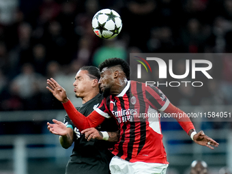 Emerson Royal of AC Milan and Darwin Nunez of Liverpool FC jump for the ball during the UEFA Champions League 2024/25 League Phase MD1 match...