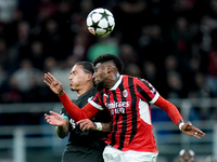 Emerson Royal of AC Milan and Darwin Nunez of Liverpool FC jump for the ball during the UEFA Champions League 2024/25 League Phase MD1 match...