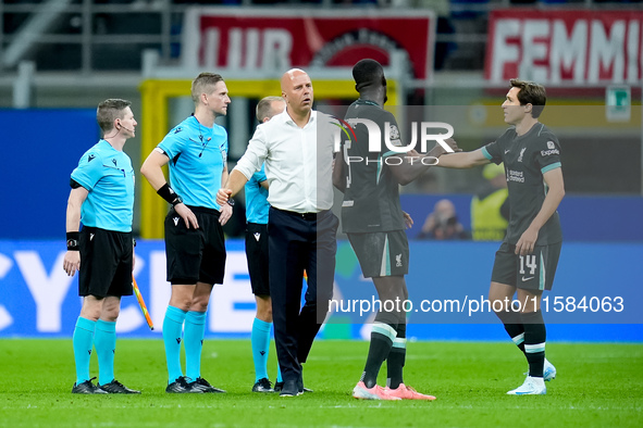 Arne Slot head coach of Liverpool FC greets Federico Chiesa of Liverpool FC during the UEFA Champions League 2024/25 League Phase MD1 match...