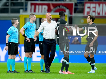 Arne Slot head coach of Liverpool FC greets Federico Chiesa of Liverpool FC during the UEFA Champions League 2024/25 League Phase MD1 match...