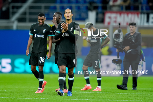 Virgil van Dijk of Liverpool FC applauds during the UEFA Champions League 2024/25 League Phase MD1 match between AC Milan and Liverpool FC a...