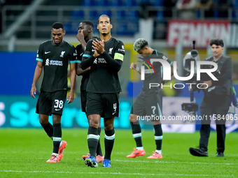 Virgil van Dijk of Liverpool FC applauds during the UEFA Champions League 2024/25 League Phase MD1 match between AC Milan and Liverpool FC a...