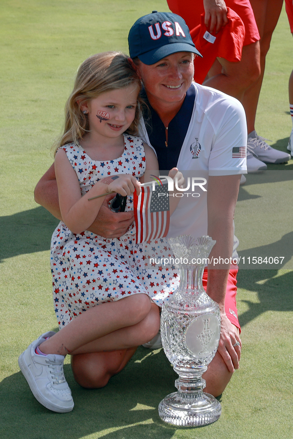 GAINESVILLE, VIRGINIA - SEPTEMBER 15: Captain Stacy Lewis of the United States poses with her daughter Chesnee at the conclusion of the Solh...