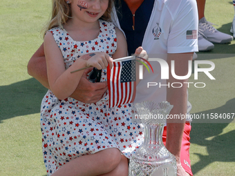 GAINESVILLE, VIRGINIA - SEPTEMBER 15: Captain Stacy Lewis of the United States poses with her daughter Chesnee at the conclusion of the Solh...