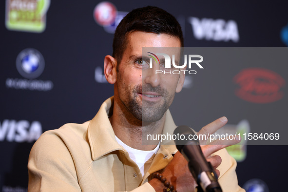 Bulgaria's Grigor Dimitrov and Serbia's Novak Djokovic speak to the media at a press conference before their tennis gala match at Arena Sofi...