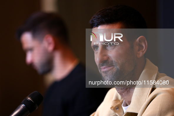 Bulgaria's Grigor Dimitrov and Serbia's Novak Djokovic speak to the media at a press conference before their tennis gala match at Arena Sofi...