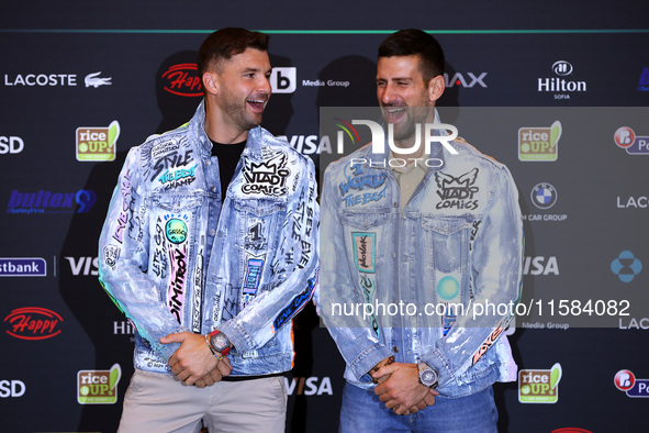 Bulgaria's Grigor Dimitrov and Serbia's Novak Djokovic speak to the media at a press conference before their tennis gala match at Arena Sofi...