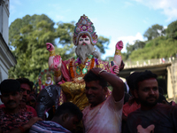 Devotees take the idol of Lord Vishwokarma to immerse it in a river on the outskirts of Kathmandu, Nepal, on September 18, 2024. Vishwokarma...