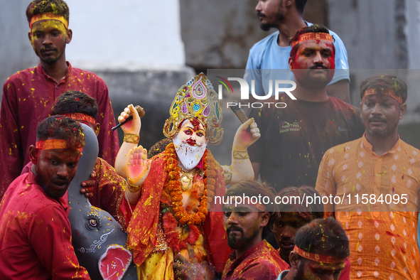 Devotees take the idol of Lord Vishwokarma to immerse it in a river on the outskirts of Kathmandu, Nepal, on September 18, 2024. Vishwokarma...