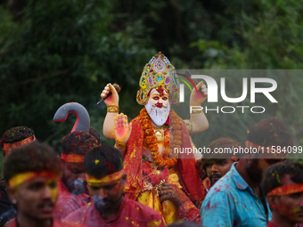 Devotees take the idol of Lord Vishwokarma to immerse it in a river on the outskirts of Kathmandu, Nepal, on September 18, 2024. Vishwokarma...