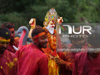 Devotees take the idol of Lord Vishwokarma to immerse it in a river on the outskirts of Kathmandu, Nepal, on September 18, 2024. Vishwokarma...