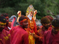 Devotees take the idol of Lord Vishwokarma to immerse it in a river on the outskirts of Kathmandu, Nepal, on September 18, 2024. Vishwokarma...