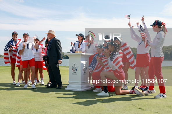 GAINESVILLE, VIRGINIA - SEPTEMBER 15: Members of Team USA look on after John Solheim, representing the Solheim family, presented the trophy...