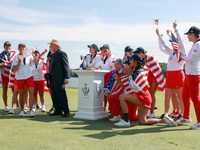 GAINESVILLE, VIRGINIA - SEPTEMBER 15: Members of Team USA look on after John Solheim, representing the Solheim family, presented the trophy...