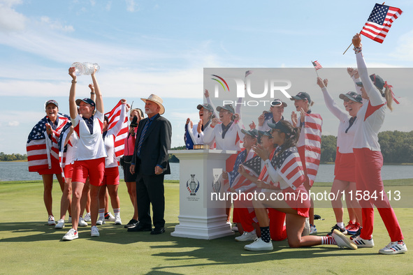 GAINESVILLE, VIRGINIA - SEPTEMBER 15: Members of Team USA look as Captain Stacy Lewis hoists the trophy  after John Solheim, representing th...