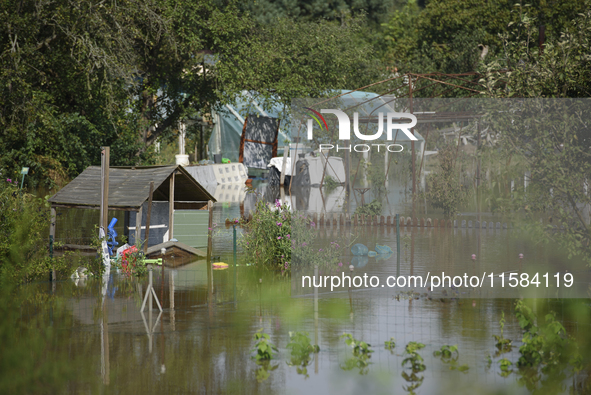 Social gardens are submerged in floodwaters in Wroclaw, Poland, on September 18, 2024. The government outlines a reconstruction plan once th...