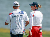 GAINESVILLE, VIRGINIA - SEPTEMBER 15: Sarah Schmelzel of the United States walks with her caddie on the 18th green after a Team USA win at t...