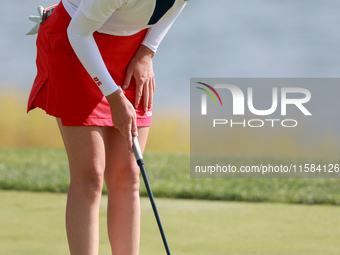 GAINESVILLE, VIRGINIA - SEPTEMBER 15: Sarah Schmelzel of the United States lines up her putt on the 18th green at the conclusion of the Solh...