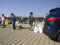 People carry sandbags as they prepare for the flood wave to reach Wroclaw, Poland, on September 18, 2024. The government outlines a reconstr...