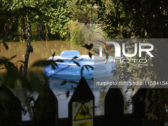 An inflatable swimming pool drifts as floodwaters reach the social gardens on the outskirts of Wroclaw, Poland, on September 18, 2024. The g...