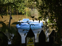 An inflatable swimming pool drifts as floodwaters reach the social gardens on the outskirts of Wroclaw, Poland, on September 18, 2024. The g...