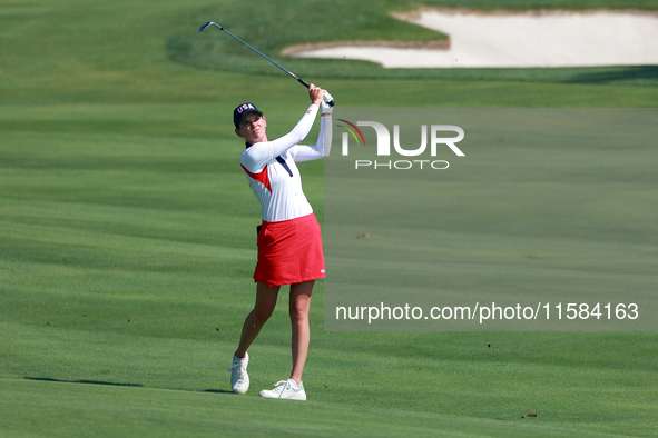 GAINESVILLE, VIRGINIA - SEPTEMBER 15: Sarah Schmelzel of the United States hits to the 18th green at the conclusion of the Solheim Cup at Ro...