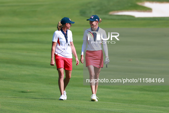 GAINESVILLE, VIRGINIA - SEPTEMBER 15: Sarah Schmelzel of the United States walks with Captain Stacy Lewis of the United States to the 18th g...