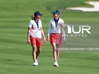 GAINESVILLE, VIRGINIA - SEPTEMBER 15: Sarah Schmelzel of the United States walks with Captain Stacy Lewis of the United States to the 18th g...