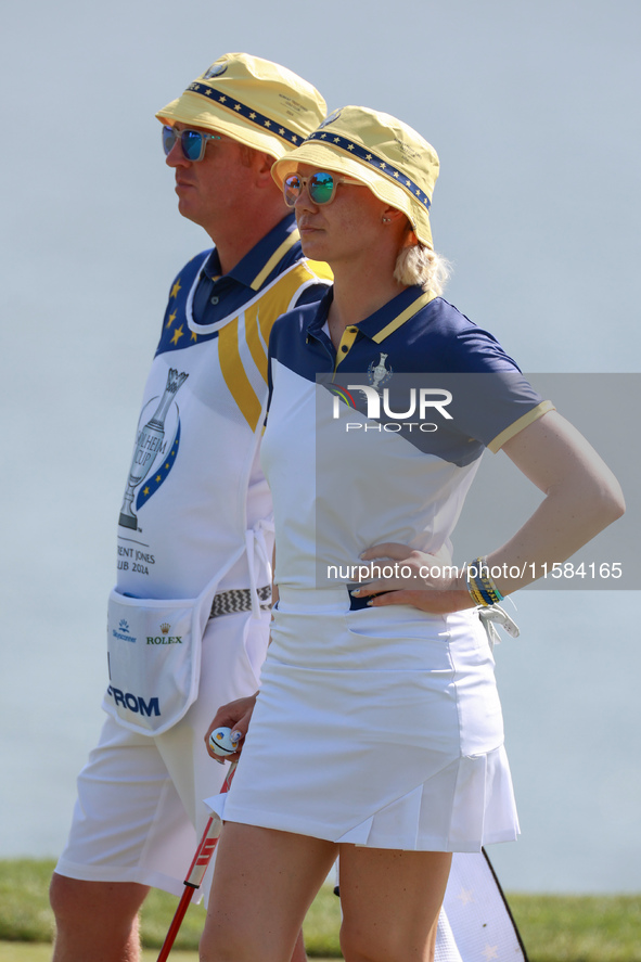 GAINESVILLE, VIRGINIA - SEPTEMBER 15: Madelene Sagstrom of Team Europe waits with her caddie on the 18th green during the final round of the...