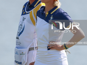 GAINESVILLE, VIRGINIA - SEPTEMBER 15: Madelene Sagstrom of Team Europe waits with her caddie on the 18th green during the final round of the...