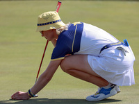 GAINESVILLE, VIRGINIA - SEPTEMBER 15: Madelene Sagstrom of Team Europe places her ball on the 18th green at the conclusion of the Solheim Cu...