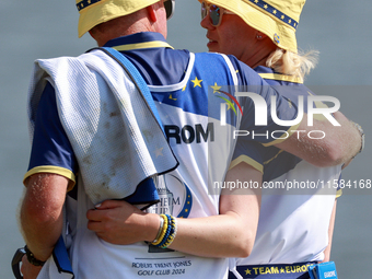 GAINESVILLE, VIRGINIA - SEPTEMBER 15: Madelene Sagstrom of Team Europe walks with her caddie on the 18th green at the conclusion of the Solh...