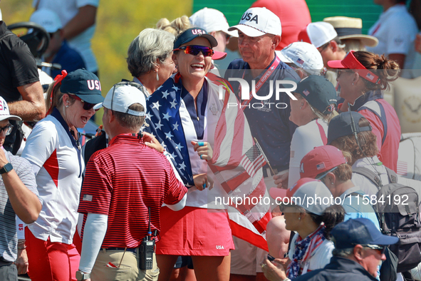 GAINESVILLE, VIRGINIA - SEPTEMBER 15: Lexi Thompson of the United States celebrates a Team USA lead on the 18th green at the conclusion of t...