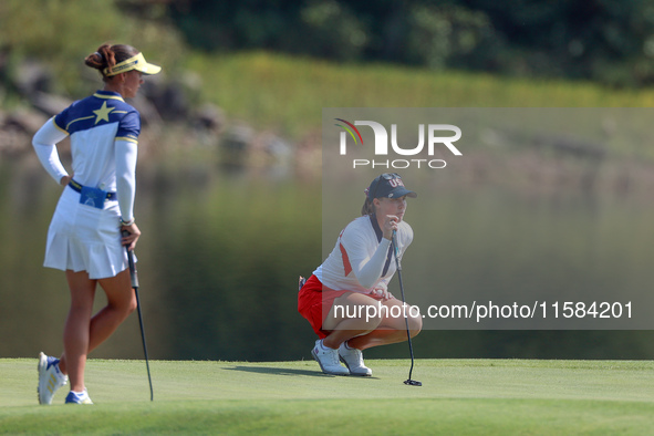 GAINESVILLE, VIRGINIA - SEPTEMBER 15: Jennifer Kupcho of the United States lines up her putt on the 11th green as Linn Grant of Team Europe...