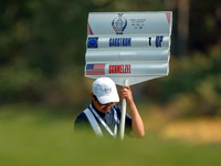 GAINESVILLE, VIRGINIA - SEPTEMBER 15: The standard bearer carries the sign displaying the score for Madelene Sagstrom of Team Europe versus...