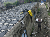 A worker carries leather at a tannery in the Hazaribagh area of Dhaka, Bangladesh, on September 18, 2024. (