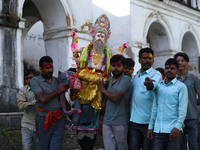 Nepali Hindu devotees carry an eco-friendly idol of Lord Bishwokarma to immerse it in the Bagmati River in Kathmandu, Nepal, on September 18...