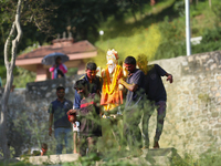 Nepali Hindu devotees carry an eco-friendly idol of Lord Bishwokarma to immerse it in the Bagmati River in Kathmandu, Nepal, on September 18...