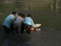 Nepali Hindu devotees immerse the eco-friendly idol of Lord Bishwokarma in the Bagmati River in Kathmandu, Nepal, on September 18, 2024. Bis...